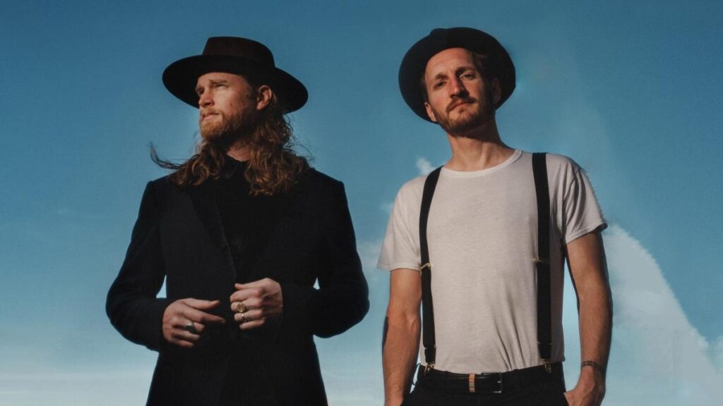 Cartel oficial del concierto de The Lumineers en Quito 2026 con fechas y ubicación en Arena Top Media
