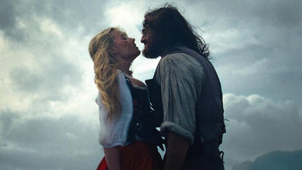 Margot Robbie y Jacob Elordi en escena oscura de 'Cumbres borrascosas' con estética gótica moderna y luces dramáticas