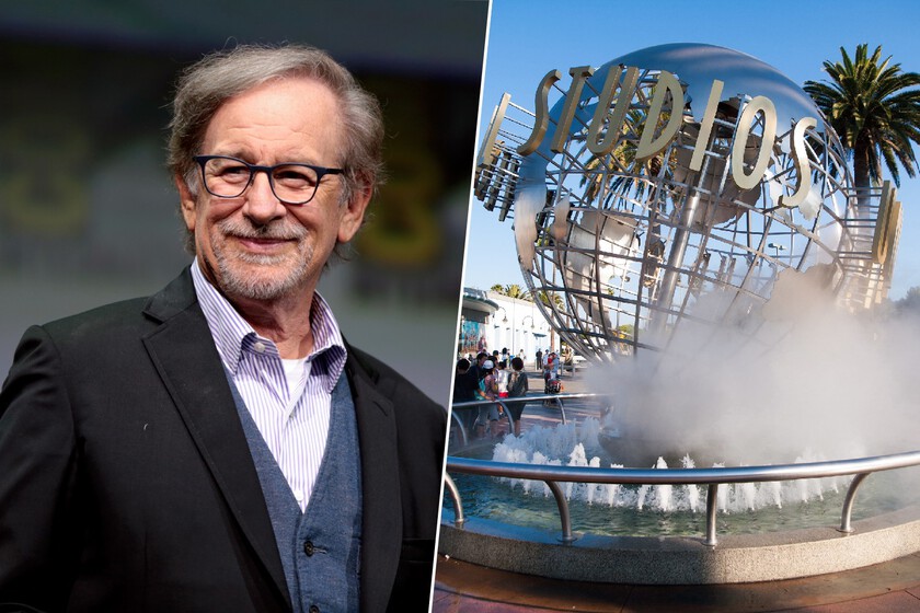 Steven Spielberg sonríe junto a un contrato firmado en 1987 con Universal Studios sobre una mesa con billetes y un plano de parque temático