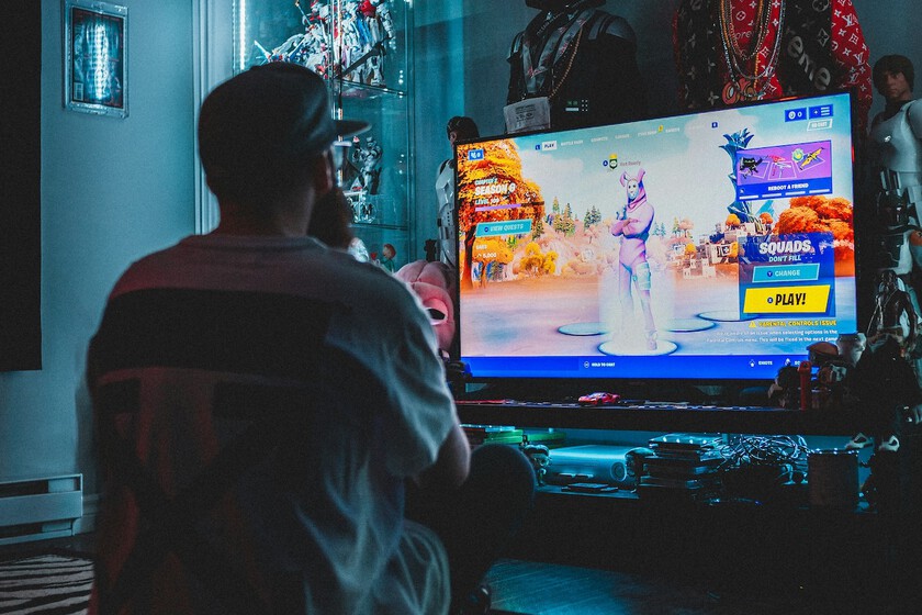 Robot con control de videojuego roto frente a pantalla con error 'Game Over' por física imposibles de calcular
