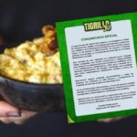 Plato de tigrillo y comunicado de cancelación del Tigrillo Fest 2026 en Quito